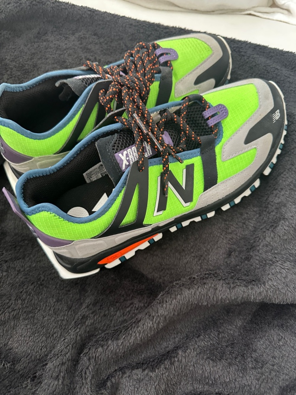 New Balance Neon Green Gray Black Trail Sneakers with Purple & Orange Accents